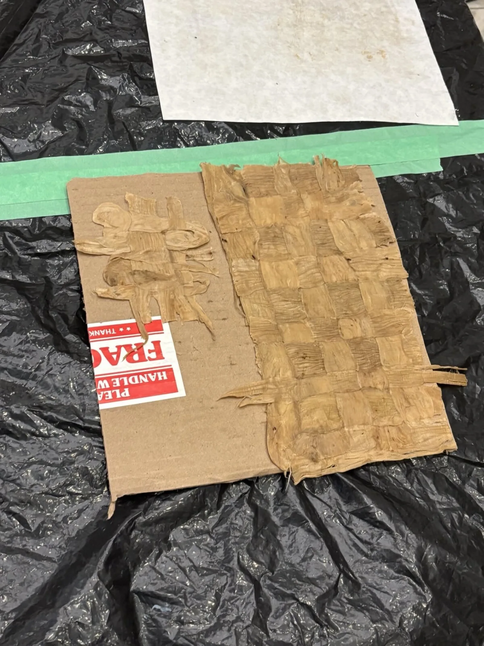 A sheet of mashed amate drying out.